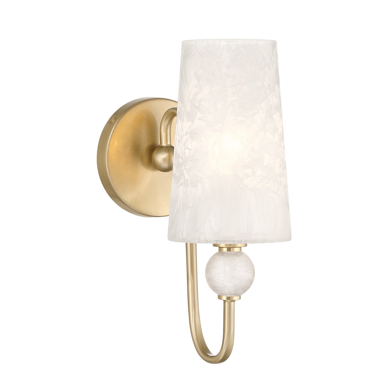 The Savoy House Sheldon 1-light sconce offers a beautifully balanced mix of sculptural form and icy texture. Its gracefully curved arm supports an ice glass shade with a softly frosted appearance that creates gentle illumination and striking visual depth. A coordinating decorative orb reinforces the fixture's polished, jewelry-inspired feel while the streamlined backplate maintains a clean and composed look. The radiant Noble Brass finish enhances Sheldon's sophisticated character, making it an elegant addition to bathrooms, hallways, bedrooms, and more. Sheldon is 12.5" in height, 5.13" in width and extends 8.5" from the wall. Uses one candelabra size bulb of up to 60 watts. Bulb not included. Damp area rated. Collection: Sheldon Rooms: Bathroom, Bedroom, Billiard Room, Closet, Dining Room, Entryway, Family Room, Great Room, Kitchen, Hallway, Living Room, Office, Powder Room, Stairway, Sunroom, Lobby, Waiting Room, Media Room Finish: Noble Brass Glass: Clear Ice Width: 5.13" Height: 12.50" Length: 8.50" Weight: 3.17 lb Extension from Wall: 8.50" Canopy: 5.13" x 5.1" x 0.88" Number of Bulbs: 1 Maximum Wattage: 60.00 W Bulb Base: E12 Light Source: Incandescent/LED Dimmable Voltage: 120.00 V Material: Metal, Glass Safety Listing: ETL/CETL Safety Rating: Damp LED